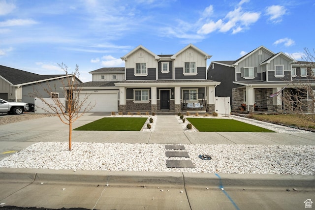 view of front of house featuring board and batten siding, concrete driveway, covered porch, and stone siding