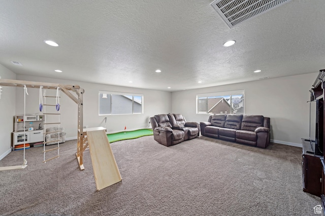 living room with recessed lighting, visible vents, and carpet floors