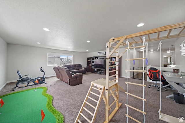workout room featuring carpet flooring, recessed lighting, baseboards, and a textured ceiling