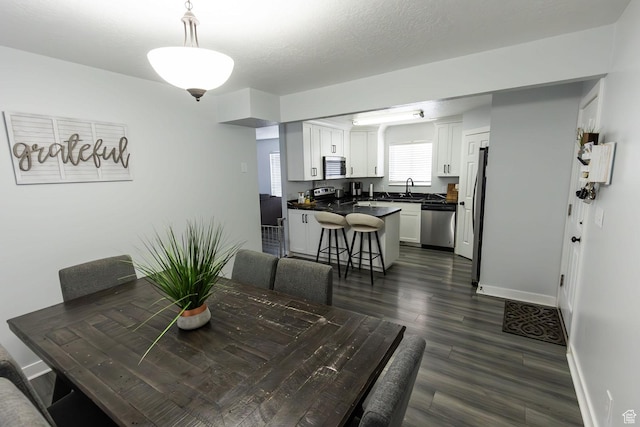 832 S 1430 E, Spanish Fork, UT 84660 - dining area with dark wood-style flooring and baseboards