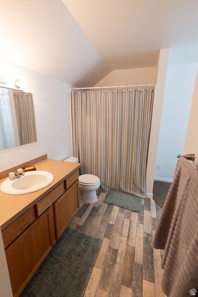 832 S 1430 E, Spanish Fork, UT 84660 - full bathroom with vanity, hardwood / wood-style floors, toilet, vaulted ceiling, and a shower with curtain