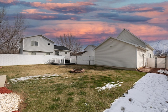 832 S 1430 E, Spanish Fork, UT 84660 - yard at dusk with a gate, a fire pit, and a wooden deck
