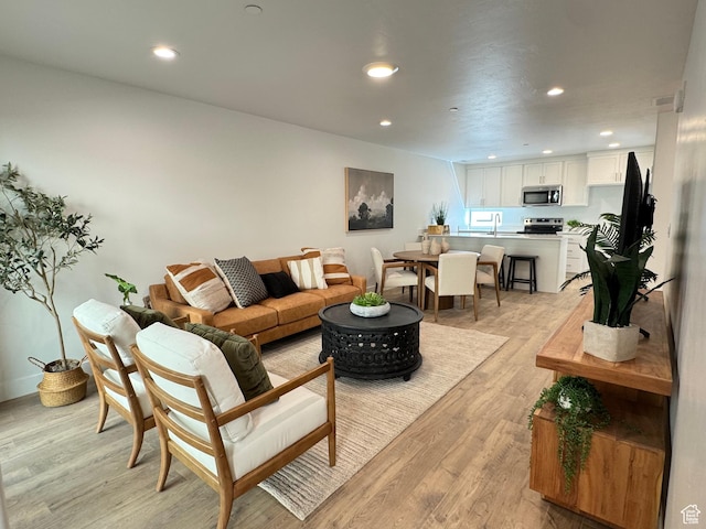 1590 S 900 W Unit 902, Salt Lake City, UT 84104 - living room with light wood-style floors and recessed lighting