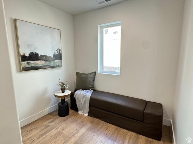 1590 S 900 W Unit 902, Salt Lake City, UT 84104 - living area featuring visible vents, baseboards, and wood finished floors