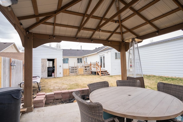 4072 N White Pine Rd E, Eagle Mountain, UT 84005 - view of patio / terrace with outdoor dining space, a gazebo, and fence