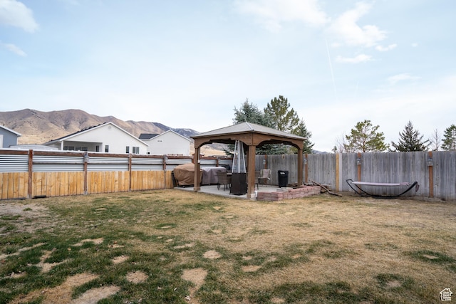 4072 N White Pine Rd E, Eagle Mountain, UT 84005 - view of yard featuring a gazebo, a patio area, a mountain view, and a fenced backyard