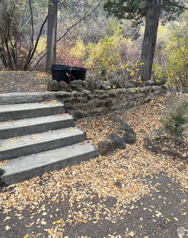 1372 S Cottonwood Ln, Hatch, UT 84735 - staircase featuring a forest view
