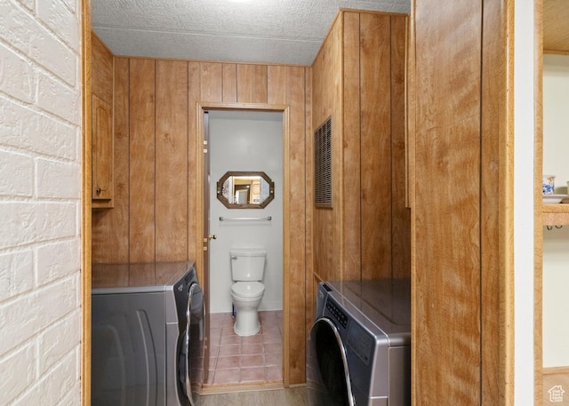 1372 S Cottonwood Ln, Hatch, UT 84735 - washroom with tile patterned flooring, cabinet space, a textured ceiling, and washer / clothes dryer
