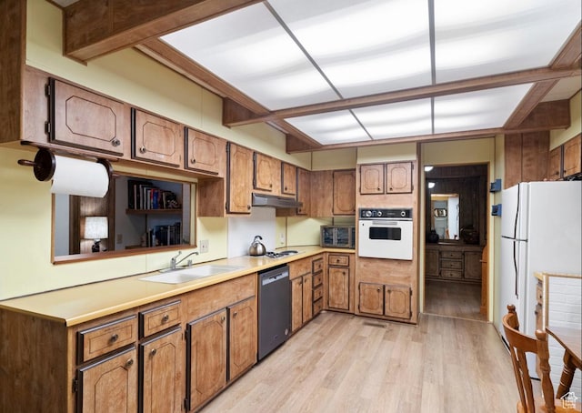 1372 S Cottonwood Ln, Hatch, UT 84735 - kitchen featuring white appliances, brown cabinetry, a sink, light wood-style floors, and under cabinet range hood