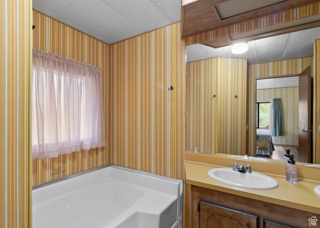 1372 S Cottonwood Ln, Hatch, UT 84735 - full bath with a bath, a textured ceiling, wallpapered walls, and vanity