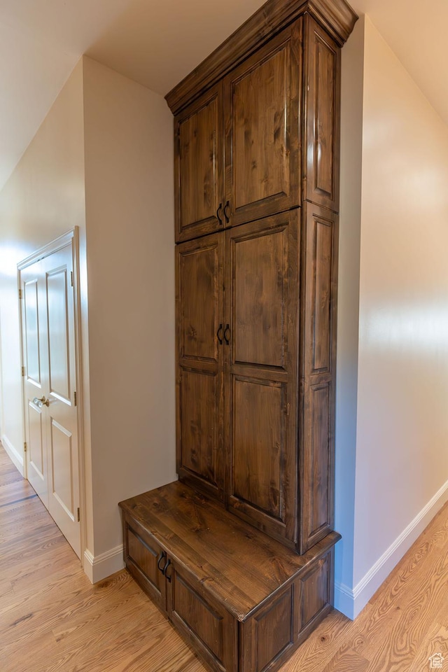 details featuring wood finished floors and baseboards