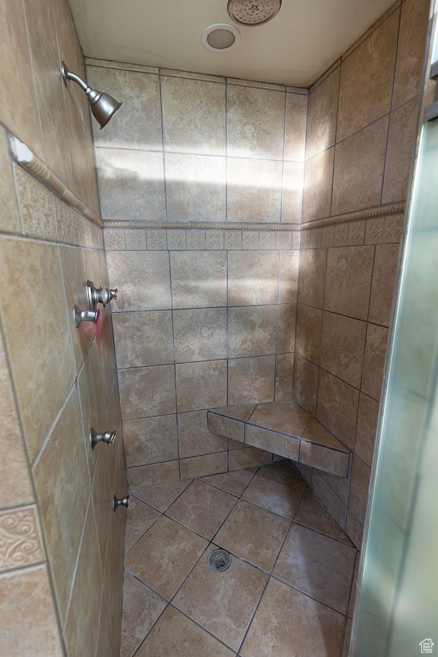 bathroom with tiled shower
