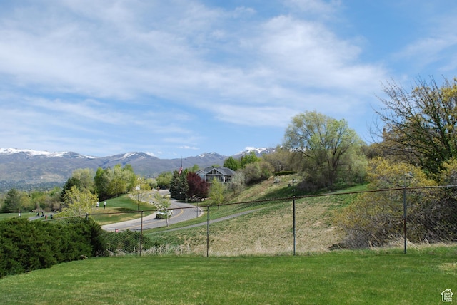 71 Gary Way N, Salt Lake, UT 84054 - view of community with a lawn, fence, and a mountain view
