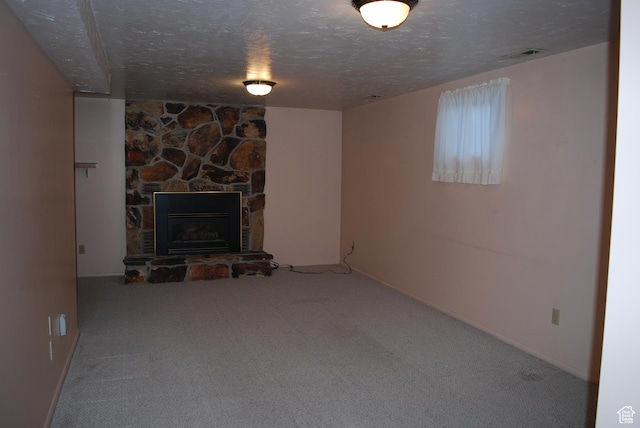 71 Gary Way N, Salt Lake, UT 84054 - unfurnished living room featuring a textured ceiling, carpet, and a fireplace