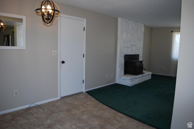 71 Gary Way N, Salt Lake, UT 84054 - unfurnished living room with a chandelier and a wood stove