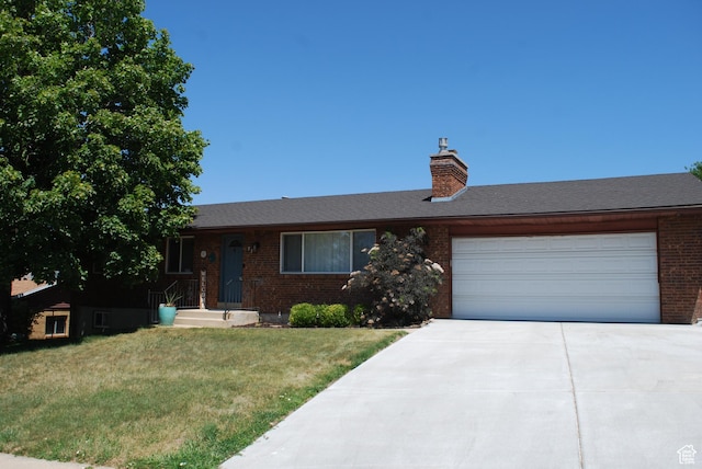 71 Gary Way N, Salt Lake, UT 84054 - single story home with brick siding, a front yard, concrete driveway, a garage, and a chimney