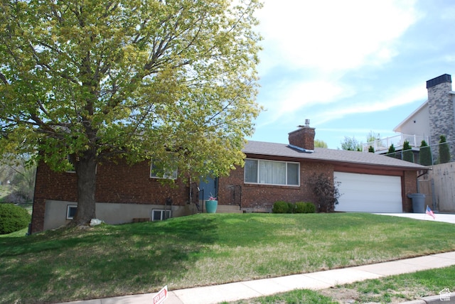 71 Gary Way N, Salt Lake, UT 84054 - ranch-style home with a front yard, driveway, an attached garage, and brick siding