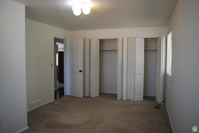 71 Gary Way N, Salt Lake, UT 84054 - unfurnished bedroom featuring two closets and carpet