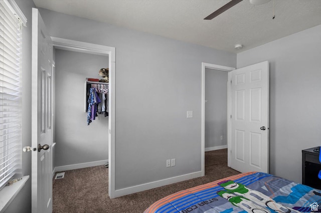 12172 S Window Arch Ln, Herriman, UT 84096 - carpeted bedroom with baseboards, visible vents, a closet, and a textured ceiling