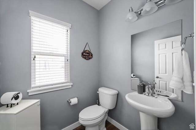 12172 S Window Arch Ln, Herriman, UT 84096 - bathroom with baseboards, a wealth of natural light, and toilet