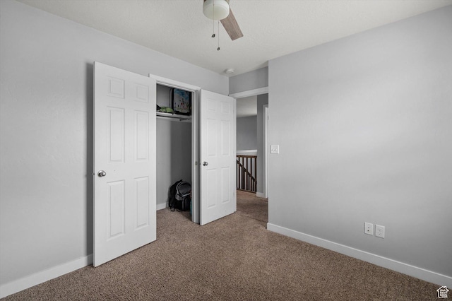 12172 S Window Arch Ln, Herriman, UT 84096 - unfurnished bedroom with baseboards, a closet, ceiling fan, and carpet