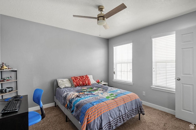 12172 S Window Arch Ln, Herriman, UT 84096 - bedroom with baseboards, a textured ceiling, a ceiling fan, and carpet