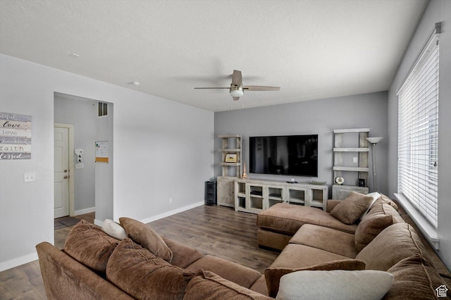 12172 S Window Arch Ln, Herriman, UT 84096 - living room featuring baseboards, a textured ceiling, visible vents, ceiling fan, and wood finished floors