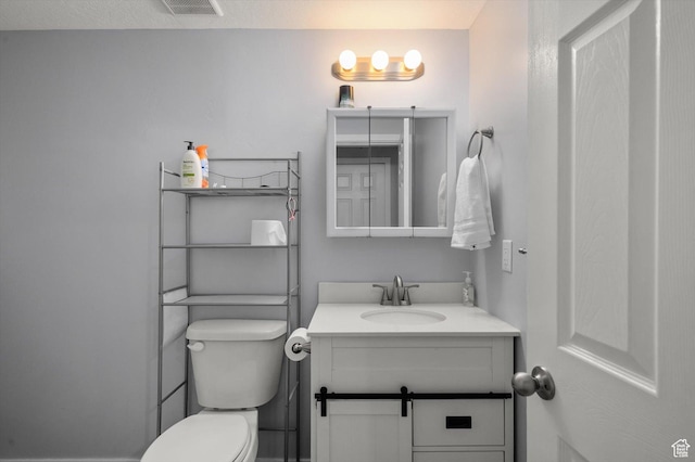 12172 S Window Arch Ln, Herriman, UT 84096 - bathroom featuring toilet, vanity, and visible vents