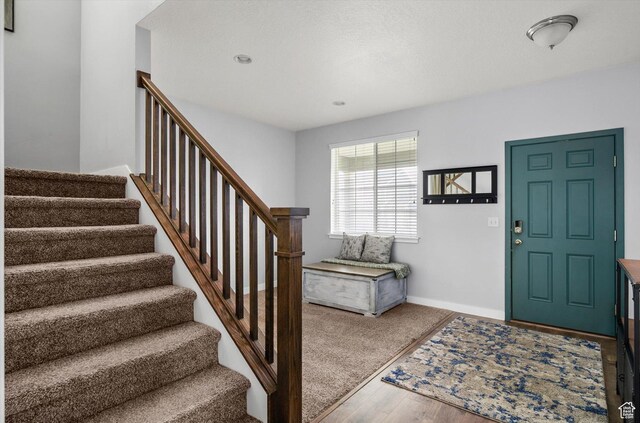 12172 S Window Arch Ln, Herriman, UT 84096 - foyer with baseboards, wood finished floors, and stairway