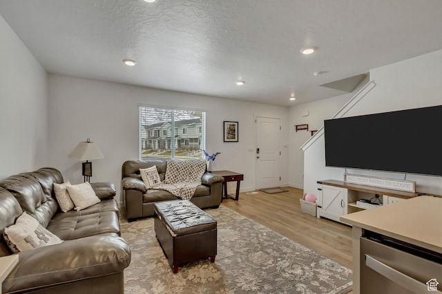1436 S Divide Dr, Santaquin, UT 84655 - living room featuring baseboards, a textured ceiling, light wood-style floors, and recessed lighting