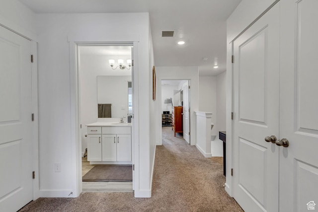 1436 S Divide Dr, Santaquin, UT 84655 - hall with light carpet, baseboards, recessed lighting, and a sink