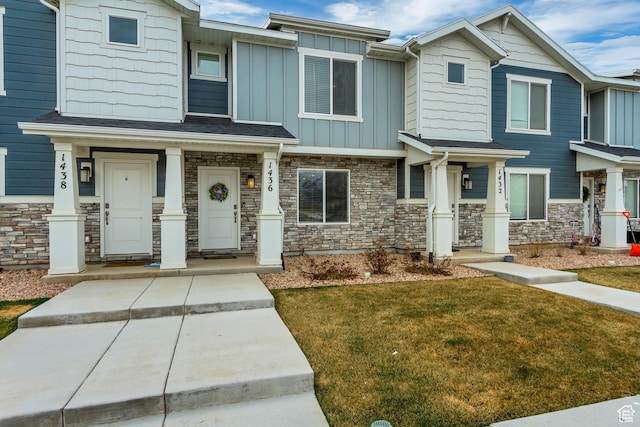 1436 S Divide Dr, Santaquin, UT 84655 - view of front of property featuring stone siding, a front lawn, and board and batten siding