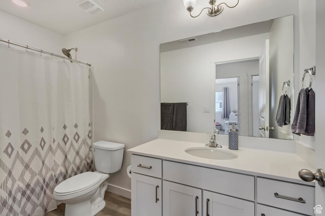 1436 S Divide Dr, Santaquin, UT 84655 - full bath with visible vents, toilet, vanity, and wood finished floors