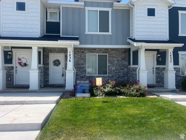 1436 S Divide Dr, Santaquin, UT 84655 - view of front of property with board and batten siding, a porch, stone siding, and a front yard