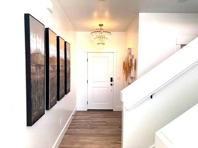 352 W Ropelato Dr, Nibley, UT 84321 - entryway featuring a chandelier, wood finished floors, baseboards, and stairs