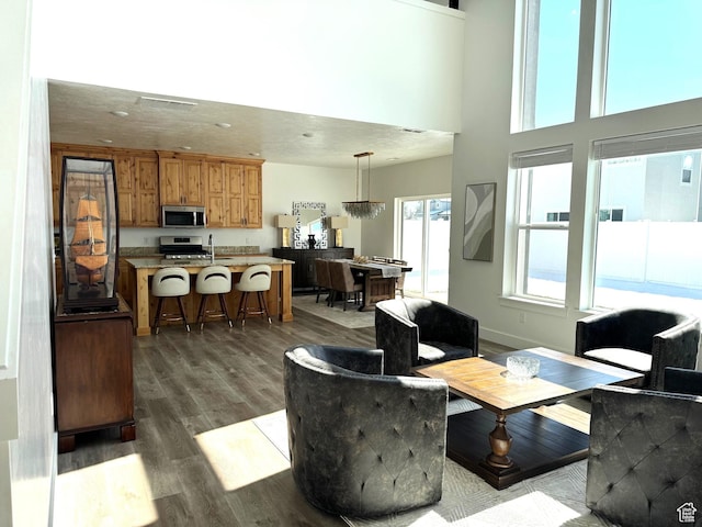 352 W Ropelato Dr, Nibley, UT 84321 - living area with dark wood-style flooring and recessed lighting