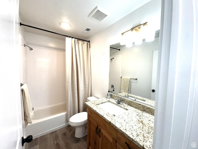 352 W Ropelato Dr, Nibley, UT 84321 - bathroom with wood finished floors, toilet, shower / tub combo, and vanity