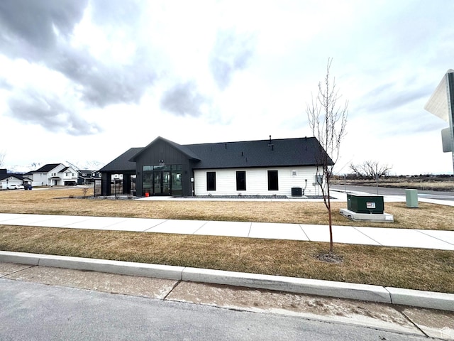 352 W Ropelato Dr, Nibley, UT 84321 - modern farmhouse featuring a front lawn and central AC unit