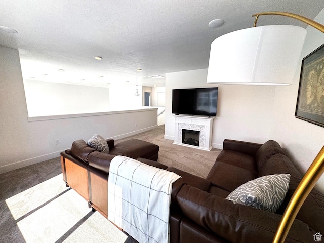 352 W Ropelato Dr, Nibley, UT 84321 - living area featuring carpet, baseboards, a fireplace, and a textured ceiling