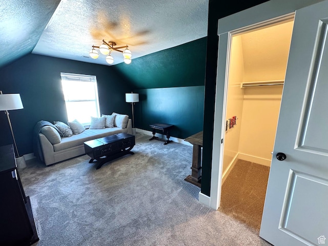 352 W Ropelato Dr, Nibley, UT 84321 - carpeted living area with lofted ceiling, a textured ceiling, and baseboards