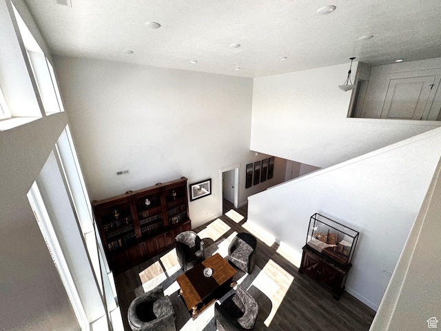 352 W Ropelato Dr, Nibley, UT 84321 - living area featuring wood finished floors, a towering ceiling, and recessed lighting