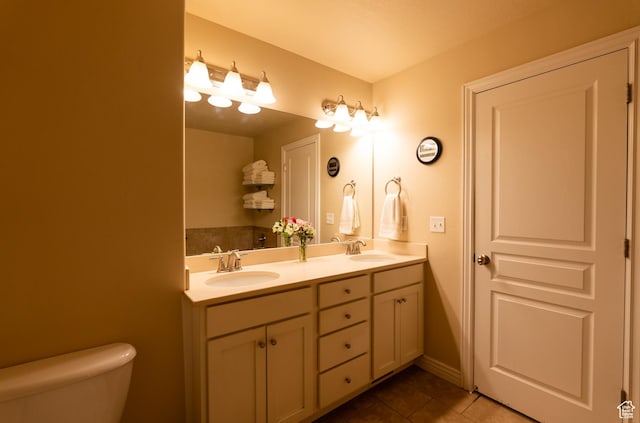 160 S 2775 W, West Point, UT 84015 - full bathroom featuring a sink, toilet, double vanity, and tile patterned floors