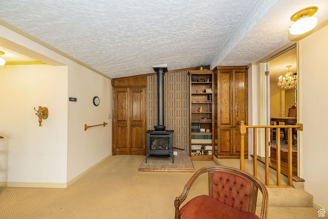 2536 N 575 E, North Ogden, UT 84414 - carpeted living room featuring a wood stove, ornamental molding, baseboards, and a textured ceiling