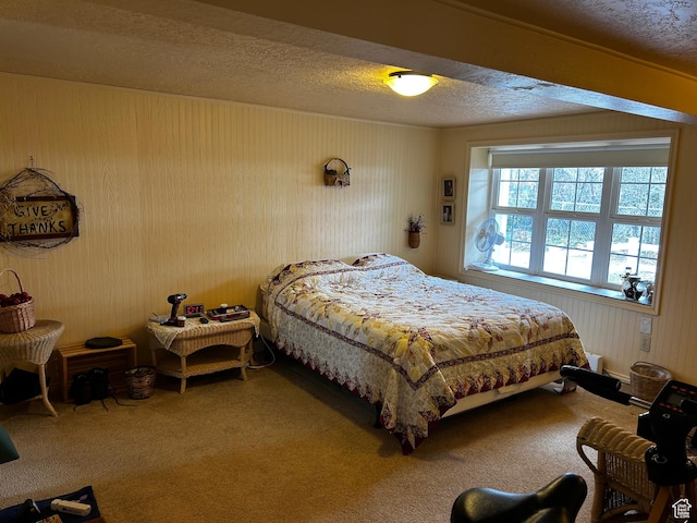 carpeted bedroom featuring a textured ceiling
