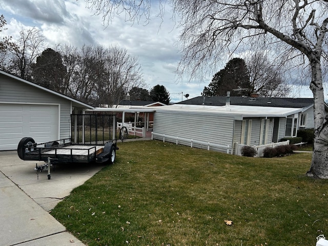 view of yard with driveway and an outdoor structure