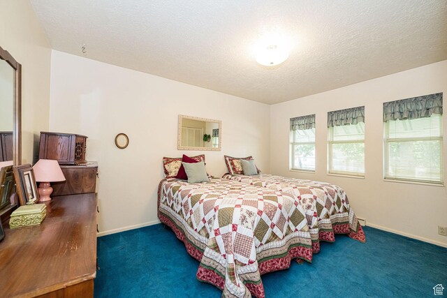 2536 N 575 E, North Ogden, UT 84414 - bedroom with carpet floors, baseboards, and a textured ceiling