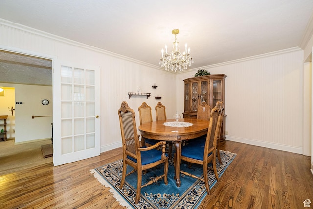 2536 N 575 E, North Ogden, UT 84414 - dining area with a chandelier, crown molding, wood finished floors, and baseboards