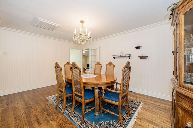 2536 N 575 E, North Ogden, UT 84414 - dining room featuring a chandelier, crown molding, wood finished floors, and baseboards