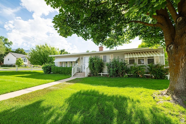 2536 N 575 E, North Ogden, UT 84414 - ranch-style home featuring a front yard and a chimney