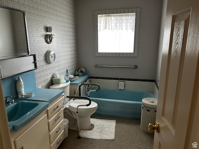 full bath featuring vanity, a garden tub, toilet, and tile walls